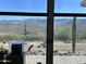 Stunning mountain views seen from a large window at 45239 N 16Th St, New River, AZ 85087