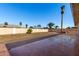 Spacious backyard with brick patio and mature palm trees at 4538 W Sierra St, Glendale, AZ 85304