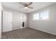 Bedroom with ceiling fan, carpet, and private bathroom access at 4538 W Sierra St, Glendale, AZ 85304