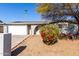 House exterior featuring a white garage door and landscaping at 4538 W Sierra St, Glendale, AZ 85304