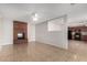 Living room features a brick fireplace and view into the kitchen at 4538 W Sierra St, Glendale, AZ 85304