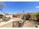 Landscaped backyard with fire pit and seating at 4602 E Monte Way, Phoenix, AZ 85044