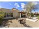 Relaxing backyard patio with fire pit, seating area, and spa at 4602 E Monte Way, Phoenix, AZ 85044