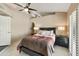 Well-lit bedroom with a queen-size bed, nightstands, and a ceiling fan at 4602 E Monte Way, Phoenix, AZ 85044