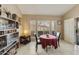 Cozy dining area with a round table, chairs, and a built-in shelving unit at 4602 E Monte Way, Phoenix, AZ 85044