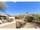 Patio with fire pit and seating area, offering mountain views at 4602 E Monte Way, Phoenix, AZ 85044