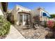 Inviting patio area with a small table and chairs, perfect for outdoor dining at 4602 E Monte Way, Phoenix, AZ 85044