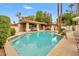 Community pool with a covered patio area and lounge chairs at 4602 E Monte Way, Phoenix, AZ 85044