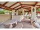 Relaxing pool area with covered seating and a barbecue at 4602 E Monte Way, Phoenix, AZ 85044