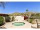 Octagonal spa surrounded by desert landscaping and a privacy wall at 4602 E Monte Way, Phoenix, AZ 85044