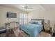 Bright bedroom with a comfortable bed, a desk, and plenty of natural light at 5132 N 31St Way # 147, Phoenix, AZ 85016