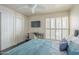 Bedroom with a queen bed, built-in closet and window shutters at 5132 N 31St Way # 147, Phoenix, AZ 85016