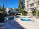 Community pool and spa with ample deck space at 5132 N 31St Way # 147, Phoenix, AZ 85016