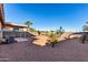 Large backyard with gravel, desert landscaping, and a covered patio at 521 W Jardin Loop, Casa Grande, AZ 85122