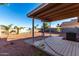 Covered patio and spacious backyard with desert landscaping at 521 W Jardin Loop, Casa Grande, AZ 85122