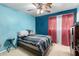 Bedroom features a double bed and ceiling fan at 521 W Jardin Loop, Casa Grande, AZ 85122