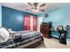 Bright bedroom with a double bed and ceiling fan at 521 W Jardin Loop, Casa Grande, AZ 85122