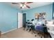 Bedroom includes a desk, drum set and ceiling fan at 521 W Jardin Loop, Casa Grande, AZ 85122