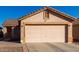 One-story house with a two-car garage and rock landscaping at 521 W Jardin Loop, Casa Grande, AZ 85122