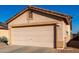 One-story house with a two-car garage and rock landscaping at 521 W Jardin Loop, Casa Grande, AZ 85122