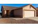 One-story house with a two-car garage and rock landscaping at 521 W Jardin Loop, Casa Grande, AZ 85122