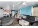 Open concept living room with gray sectional couch and blue walls at 521 W Jardin Loop, Casa Grande, AZ 85122