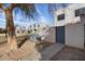 Tan stucco building exterior with a gray gate and walkway at 5238 N 42Nd Ln, Phoenix, AZ 85019