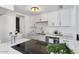 Modern kitchen with white cabinets and marble countertops at 5238 N 42Nd Ln, Phoenix, AZ 85019