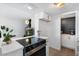 Modern kitchen with white cabinets, marble countertops, and stainless steel appliances at 5238 N 42Nd Ln, Phoenix, AZ 85019