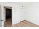 Bright bedroom with light wood floors and closet at 5238 Nw 42Nd Ln, Phoenix, AZ 85019