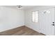 Simple dining area with wood-look flooring and white walls at 5238 Nw 42Nd Ln, Phoenix, AZ 85019