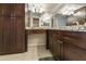 Bathroom boasts granite countertops and dark wood cabinets at 534 S Palo Verde Way, Mesa, AZ 85208