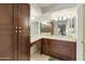 Updated bathroom with granite countertop and dark wood cabinets at 534 S Palo Verde Way, Mesa, AZ 85208