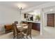 Bright dining area with wood table and chairs, adjacent to the kitchen at 534 S Palo Verde Way, Mesa, AZ 85208