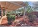 Landscaped backyard with a brick pathway at 5491 W Pueblo Dr, Eloy, AZ 85131