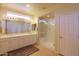 Bathroom with double vanity and a glass shower at 5491 W Pueblo Dr, Eloy, AZ 85131