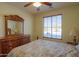 Bright bedroom with wood furniture and a view at 5491 W Pueblo Dr, Eloy, AZ 85131