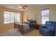 Spacious bedroom with a post bed and ceiling fan at 5491 W Pueblo Dr, Eloy, AZ 85131