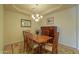 Elegant dining room with wood table, chairs, and chandelier at 5491 W Pueblo Dr, Eloy, AZ 85131