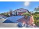 Front view of house with driveway and desert landscaping at 5491 W Pueblo Dr, Eloy, AZ 85131