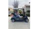 EZGO golf cart in the driveway at 5491 W Pueblo Dr, Eloy, AZ 85131