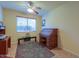 Home office with a rolltop desk and ceiling fan at 5491 W Pueblo Dr, Eloy, AZ 85131