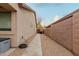 Side yard with a concrete walkway and gravel at 5711 W Lydia Ln, Laveen, AZ 85339