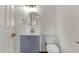 Updated bathroom with gray vanity and gold fixtures at 5921 W Hearn Rd, Glendale, AZ 85306