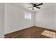 Spacious bedroom with hardwood floors and a ceiling fan at 5921 W Hearn Rd, Glendale, AZ 85306