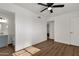 Bright bedroom with wood floors and ceiling fan at 5921 W Hearn Rd, Glendale, AZ 85306