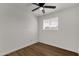 Simple bedroom with hardwood floors and a ceiling fan at 5921 W Hearn Rd, Glendale, AZ 85306