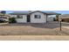 Newly remodeled single story home with a gravel front yard at 5921 W Hearn Rd, Glendale, AZ 85306