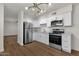 Updated kitchen with stainless steel appliances and white shaker cabinets at 5921 W Hearn Rd, Glendale, AZ 85306