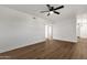 Living room with wood floors and ceiling fan at 5921 W Hearn Rd, Glendale, AZ 85306